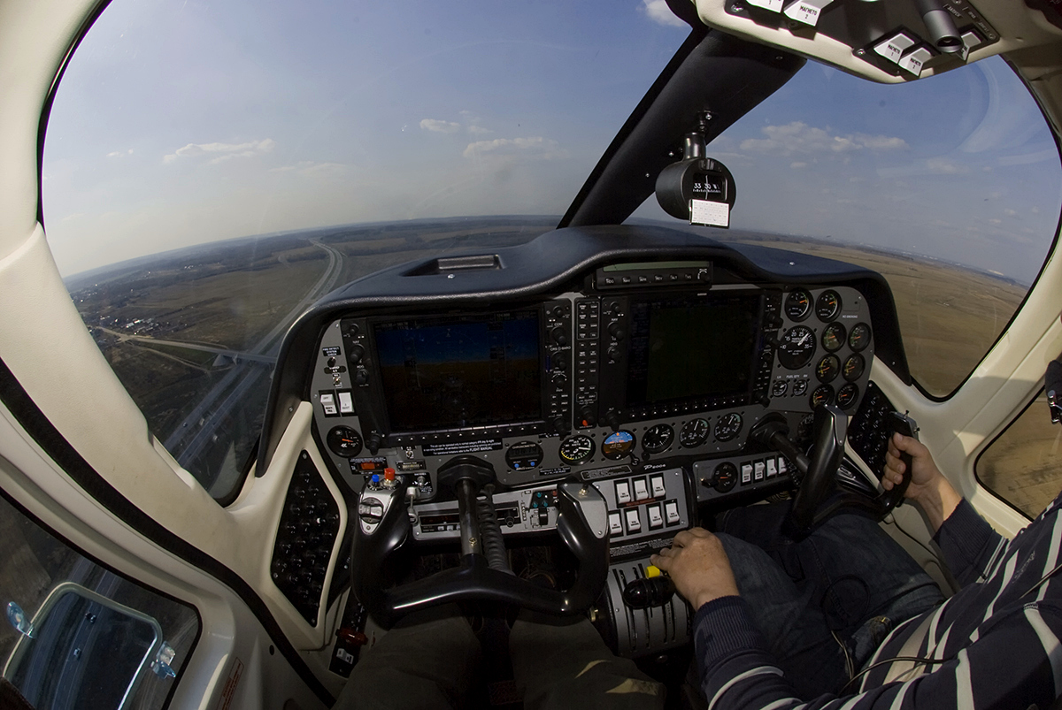 Small aircraft in flight against an open sky, representing the experience and passion of a certified pilot